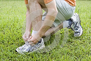 Jogger tying his shoes