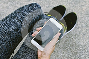 Jogger using smart phone, Female fitness exercise and cellphone.