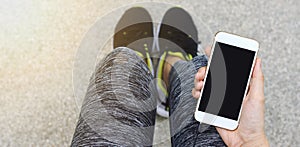 Jogger using smart phone, Female runner holding cell phone.