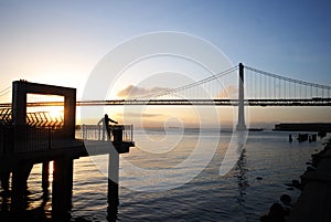 Jogger warming up near San Francisco Bay bridge