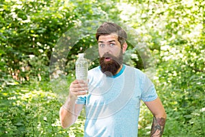 jogging drinking water. guy maintains body water balance. hydration. daily water.