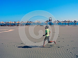 Jogging on the long beach of Ulcinj, Montenegro.