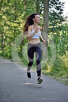 Jogging in the park - woman in her 30`s