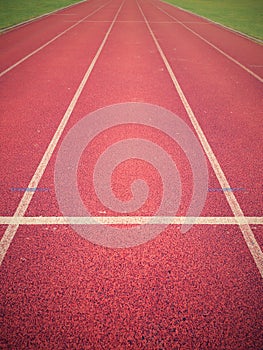 Jogging track, outdoor oval stadium with a tartan track.