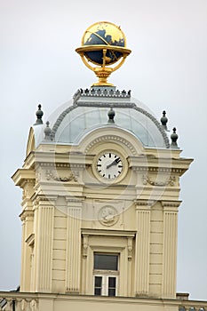 Johannes Kepler statue on vienna facade with gold globus on the