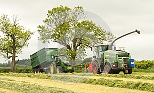 A John Deere tractor with Fendt Katana 65 forager