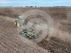 John Deere 8300 tractor pulling a John Deere 726 disc harrow