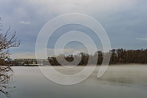 John F. Kennedy Center for the Performing Arts across Potomac River, winter fog on the water.