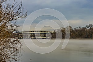 John F. Kennedy Center for the Performing Arts across Potomac River, winter fog on the water.