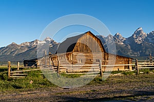 John Moulton Barn at Mormon Row in Grand Teton National Park on a clear, sunny morning in summer