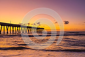 Johnnie Mercers Fishing Pier at sunrise in Wrightsville Beach east of Wilmington,North Carolina,United State.