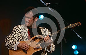 Johnny Clegg performing on stage