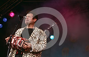 Johnny Clegg performing on stage
