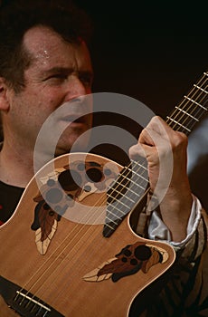 Johnny Clegg performing on stage