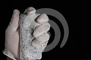 Johnson Matthey 1 Kilo Silver Bar Hand Held (reverse) photo