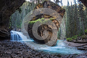 Johnston Canyon cave in Spring season with waterfalls, Johnston Canyon Trail, Alberta, Canada