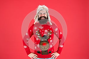 Join holiday party craze and host Ugly Christmas Sweater Party. Sweater with deer. Hipster bearded man wear winter photo