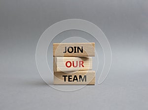 Join our team symbol. Wooden blocks with words Join our team. Beautiful grey background. Business and Join our team concept. Copy