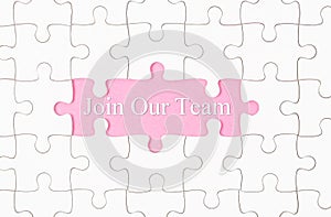 Join Our Team text with white jigsaw puzzle board