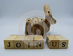 Join us concept with wooden hand on white background