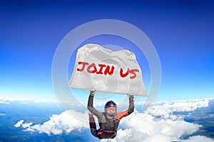 Join us. Flag in skydiving. People in free fall.Teampleat skydiver. Extreme sport.