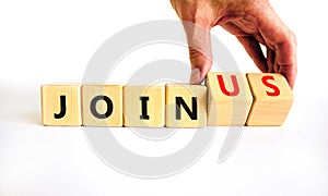 Join us symbol. Businessman turns wooden cubes and changes concept words Join to Join us. Beautiful white background. Business