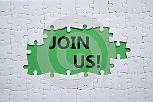 Join us symbol. Concept word Join us on white puzzle. Beautiful green background. Business and Join us concept. Copy space