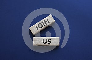 Join us symbol. Concept word Join us on wooden blocks. Beautiful deep blue background. Business and Join us concept. Copy space