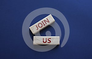Join us symbol. Concept word Join us on wooden blocks. Beautiful deep blue background. Business and Join us concept. Copy space