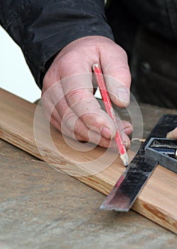 Joiner marking up timber photo