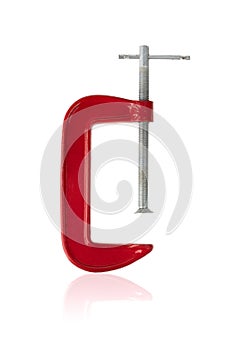 Red clamp on a white background. Joiner`s clamp close-up