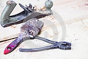 Joiner`s tools: hammer, jack plane and pliers