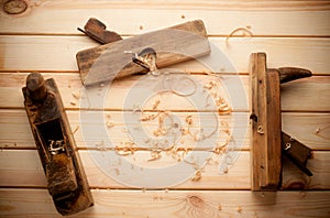 Joiner tools on wood table background with photo