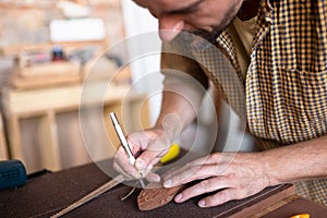 A joiner using his chisel