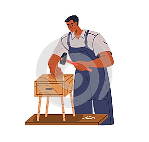 Joinery, making wood furniture. Craft worker, artisan, craftsman during woodwork, creating wooden nightstand