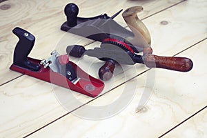 Joinery Ã¢â¬â old wooden plane, wood polishing tool in a workshop of the carpenter, retro concept