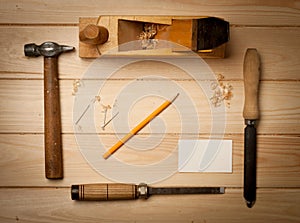 Joinery tools on wood table background with