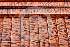 Joinery. Wood veneer wall panels elements are covered with dust. Rosewood reconstituted veneer. Furniture manufacturing
