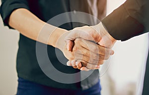 Joint Hands of Two Businessmen After Negotiating a Successful Business Agreement, And the handshake together.