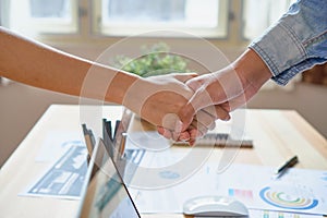 Joint Hands of Two Businessmen After Negotiating a Successful Business Agreement, And the handshake together.