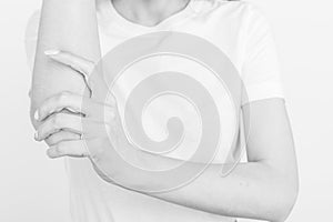 Joint injuries, fatigue at work. Area of the injury, the image on a clean background. Spasm on the girl`s arm