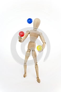 Jointed doll juggling with balls photo