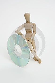 Jointed doll juggling with cd photo