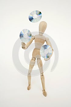 Jointed doll juggling with cds photo