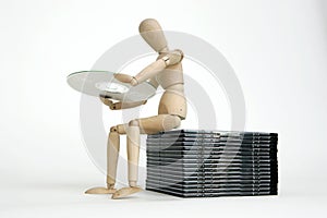 Jointed doll sitting cd stack