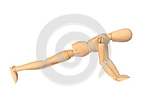 Jointed wooden mannequin doing push-ups photo