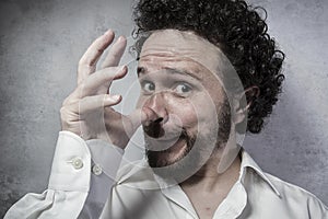 Joke, decisionmaking, man in white shirt with funny expressions photo