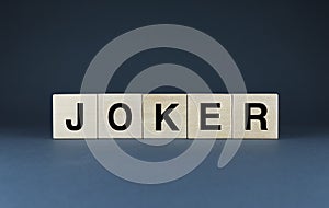 Joker. The cubes form the word Joker