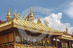 Jokhang temple gplden roof in Lhasa, Tibet with beautiful clouds