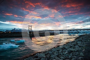 jokulsarlon Lagoon in Iceland at Sunset - sunset behind bridge over lagoon